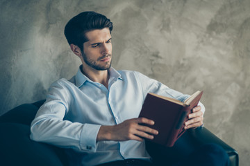 Profile side photo of focused businessman executive want study read paperbook businessman look...