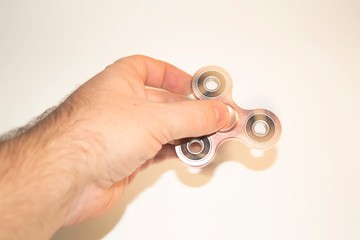 Spinner in the hand.The hand holds a spinner