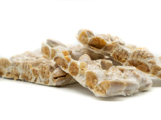 close up of nougat on white background, christmas food