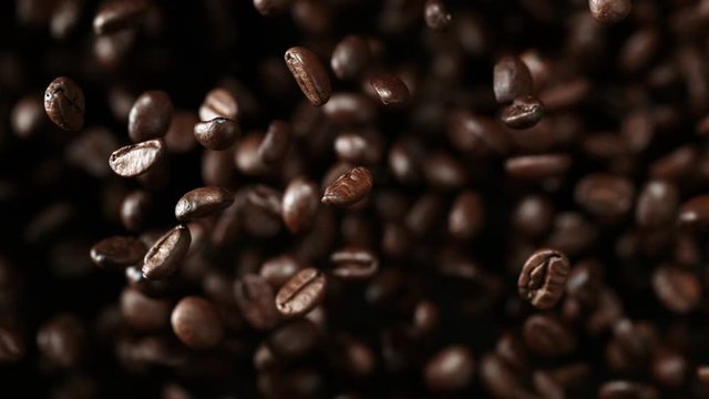 Super slow motion of flying coffee beans. Filmed on high speed cinema camera, 1000 fps.