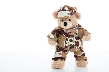 Cute teddy bear in soldier uniform isolated against white background