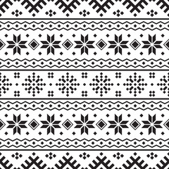 Knitted Christmas Ethnic pattern on white background. Ornament. Border. Seamless sample. It can be used as a background. Vector illustration.