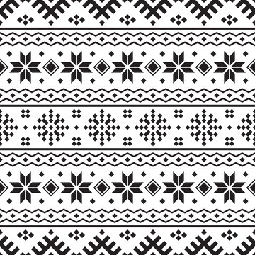 Knitted Christmas Ethnic pattern on white background. Ornament. Border. Seamless sample. It can be used as a background. Vector illustration.