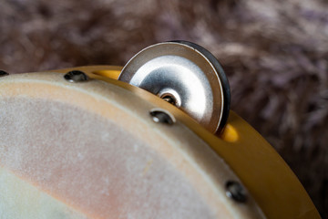 Tambourine a percussion musical instrument with a stretched drum skin