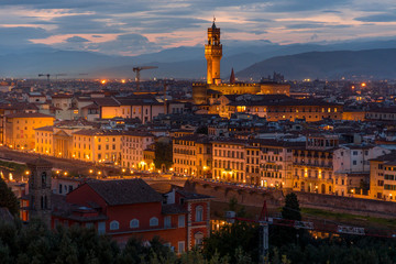 FLORENCE, TUSCANY/ITALY - OCTOBER 18 : Distant view of Palazzo Vecchio at dusk in Florence on October 18, 2019