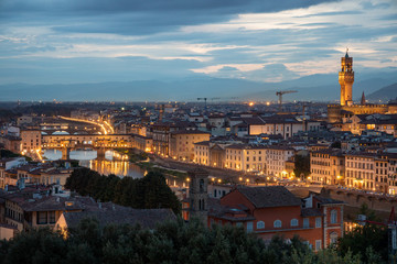 Fototapeta na wymiar FLORENCE, TUSCANY/ITALY - OCTOBER 18 : Distant view of Palazzo Vecchio at dusk in Florence on October 18, 2019