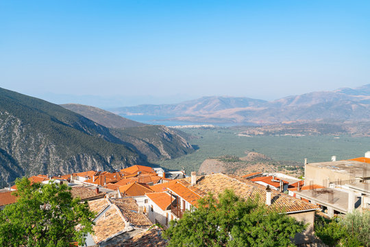 from Delphi, overlooking the towns roof-tops and down valley to part od Corinthian coast and little town Itea