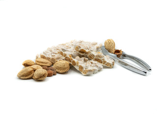 nougat with almonds and tongs, christmas food