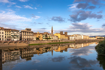 Fototapeta na wymiar FLORENCE, TUSCANY/ITALY - OCTOBER 18 : View of buildings along and across the River Arno in Florence on October 18, 2019. Unidentified people.