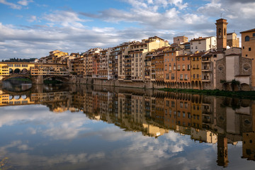 Fototapeta premium FLORENCE, TUSCANY/ITALY - OCTOBER 18 : View of buildings along and across the River Arno in Florence on October 18, 2019. Unidentified people.