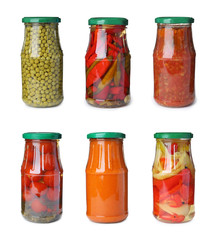 Set of glass jars with different pickled vegetables on white background