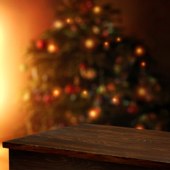 Wooden corner table of free space for your decoration and blurred christmas tree 