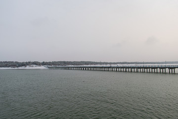 Fototapeta na wymiar View of Palanga city from end of Palanga bridge in winter