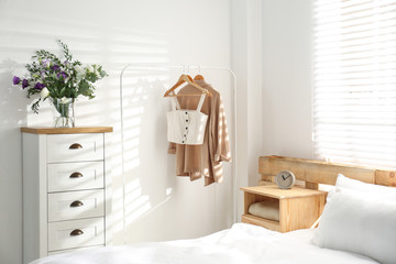 Stylish bedroom with modern chest of drawers