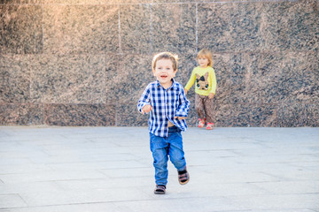 Portrait of a boy in a shirt on the street. Beautiful boy. Little boy. Walk. A child's smile.