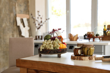 Products on dining table in modern kitchen interior