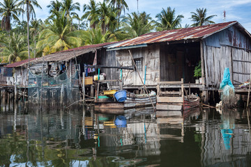 Riverside houses in the fishing village of Prek Svay, Koh Rong island, Cambodia, south east Asia, on a calm sunny day.