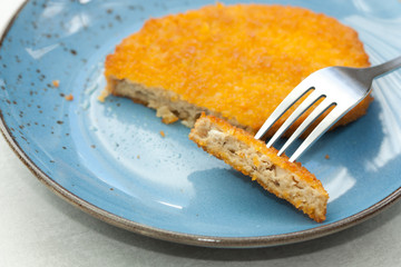 Tasty vegetarian schnitzel on a blue plate. Plant based meat.