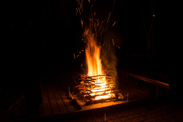 Burning camp fire at dark night