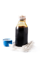 Medical iodine in a bottle and gauzes isolated on white background