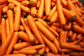 Orange sweet carrots are sold in the market