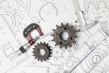 Driving prockets, micrometer and engineering drawings of industrial parts and mechanisms