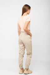 girl in beige cargo pants and a t-shirt