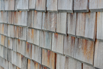close up of decorative wooden wall made of old boards. Perspective view. Interior or exterior design