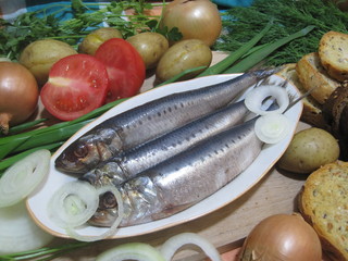 fresh fish (herring) with vegetables and bread for Christmas party in Russia