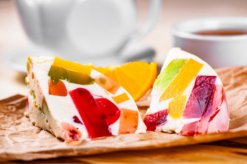 Milk dessert made of gelatin and tea on wooden board