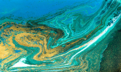 Fototapeta na wymiar Blue and gold marbling ripple of agate.