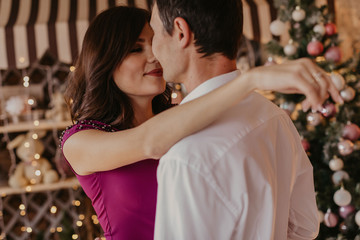 Happy couple celebrating Christmas together .