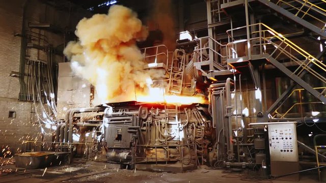Steel production in a steelmaking furnace. Metallurgy. Casting ingot. Electric arc furnace shop. Shop EAF. Plant for the production of steel. An electric melting furnace.