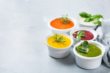 Set of seasonal fall autumn creamy soups on a table