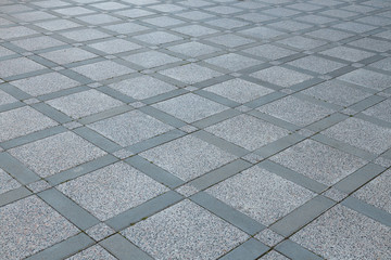 Top view of diagonal grey diamond shaped square pavement of different sized, top view. Exterior...
