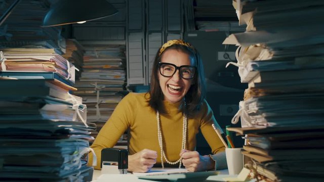 Cheerful woman celebrating in the office