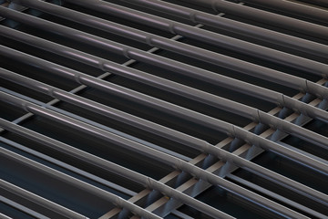 Angular view close-up of dark metal beams structure in fragment of building