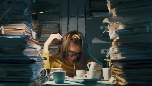 Sleepy office clerk working overtime