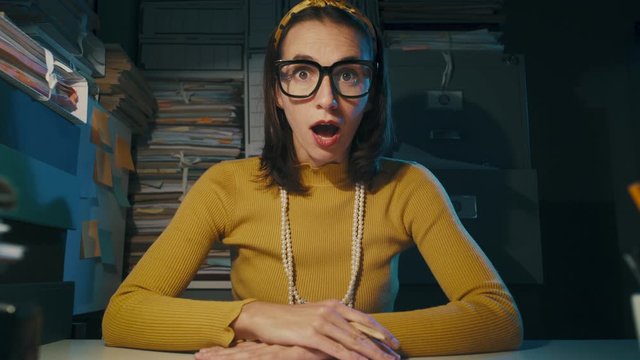 Shocked office worker receiving an unexpected bad surprise