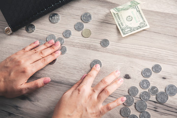 woman hand coins with wallet