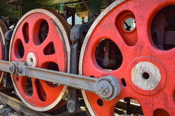 red steam locomotive wheels, metal wheels of an old steam locomotive
