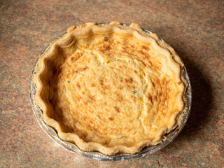 Quiche lorraine close up. French style pastry food.