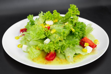 Greek salad on a black background