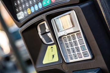 PIN pad on parking meter in city