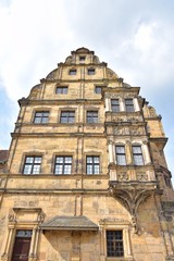 Bamberg, Germany - May 2019. Historical building in th old town of Bamberg (Bavaria, Franconia). View on famous tourist attraction in the center of Bamberg. Tourists visiting the sights of the town 