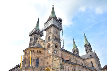 Fototapeta premium Bamberg, Germany - May 2019. Historical building in th old town of Bamberg (Bavaria, Franconia). View on famous tourist attraction in the center of Bamberg. Tourists visiting the sights of the town 