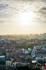 Fototapeta premium An amazing panoramic view of the city of Lisbon from the Miradouro da Senhora do Monte during sunset time.