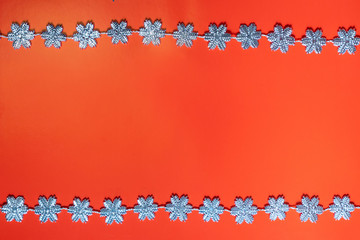 Christmas bright red background with silver snowflakes around the perimeter. Christmas concept....