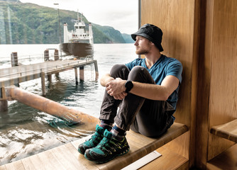 man waiting for ferry boat