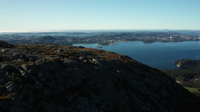 Pull Up Aerial View of Norwegian Fjord and Coastal City From Top of Mountainous Hill. Dalsnuten Rogaland Norway